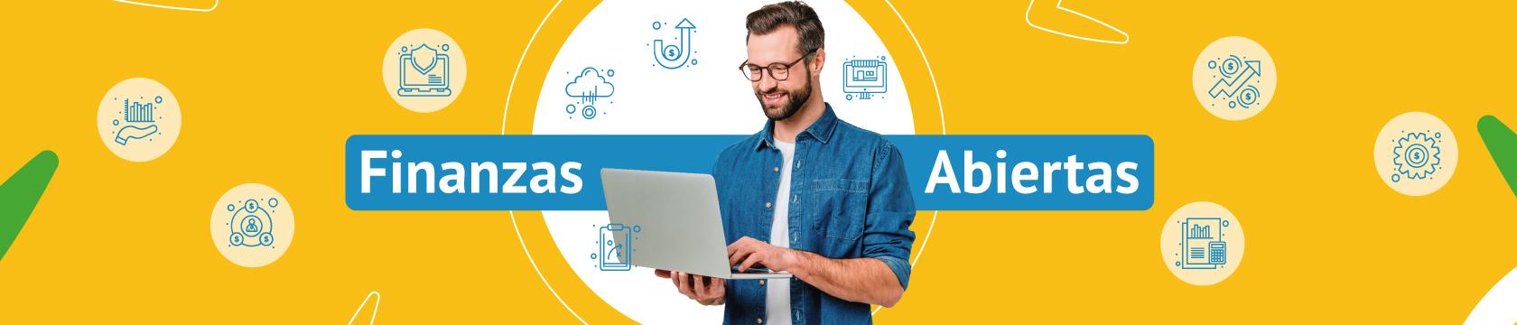 Hombre joven con computador en la mano